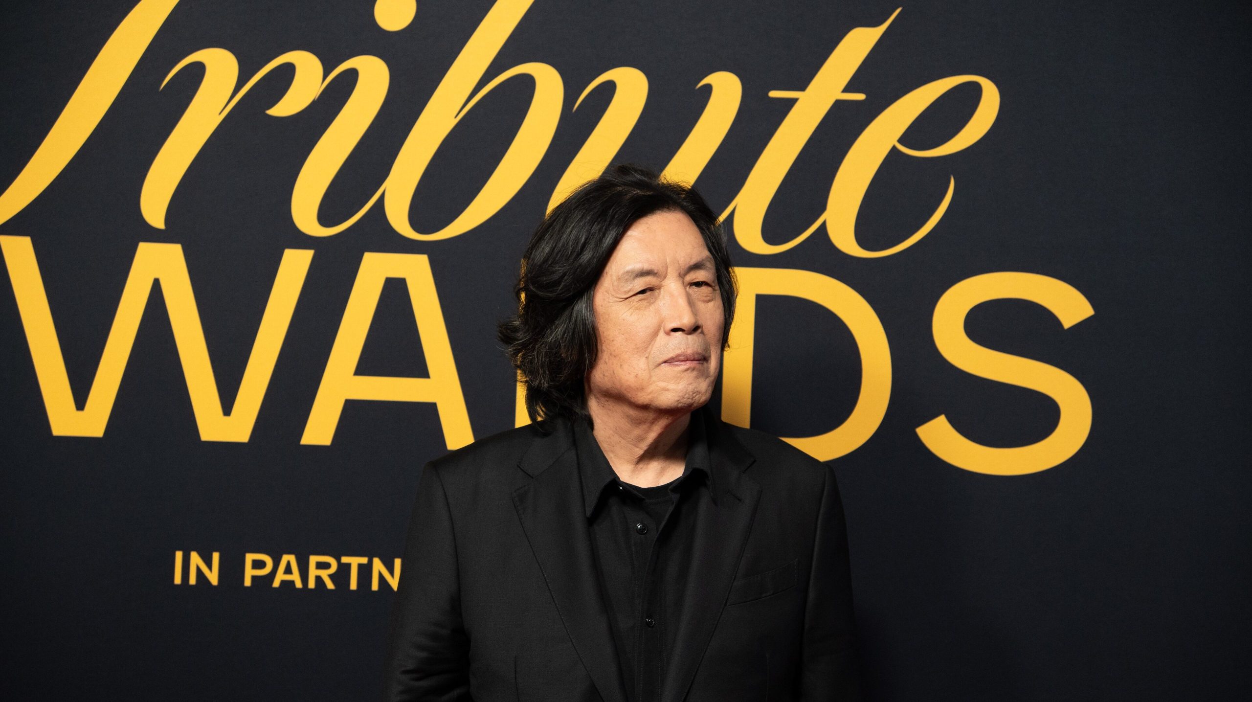 Lee Chang-dong posing at the 2026 TIFF Tribute Awards