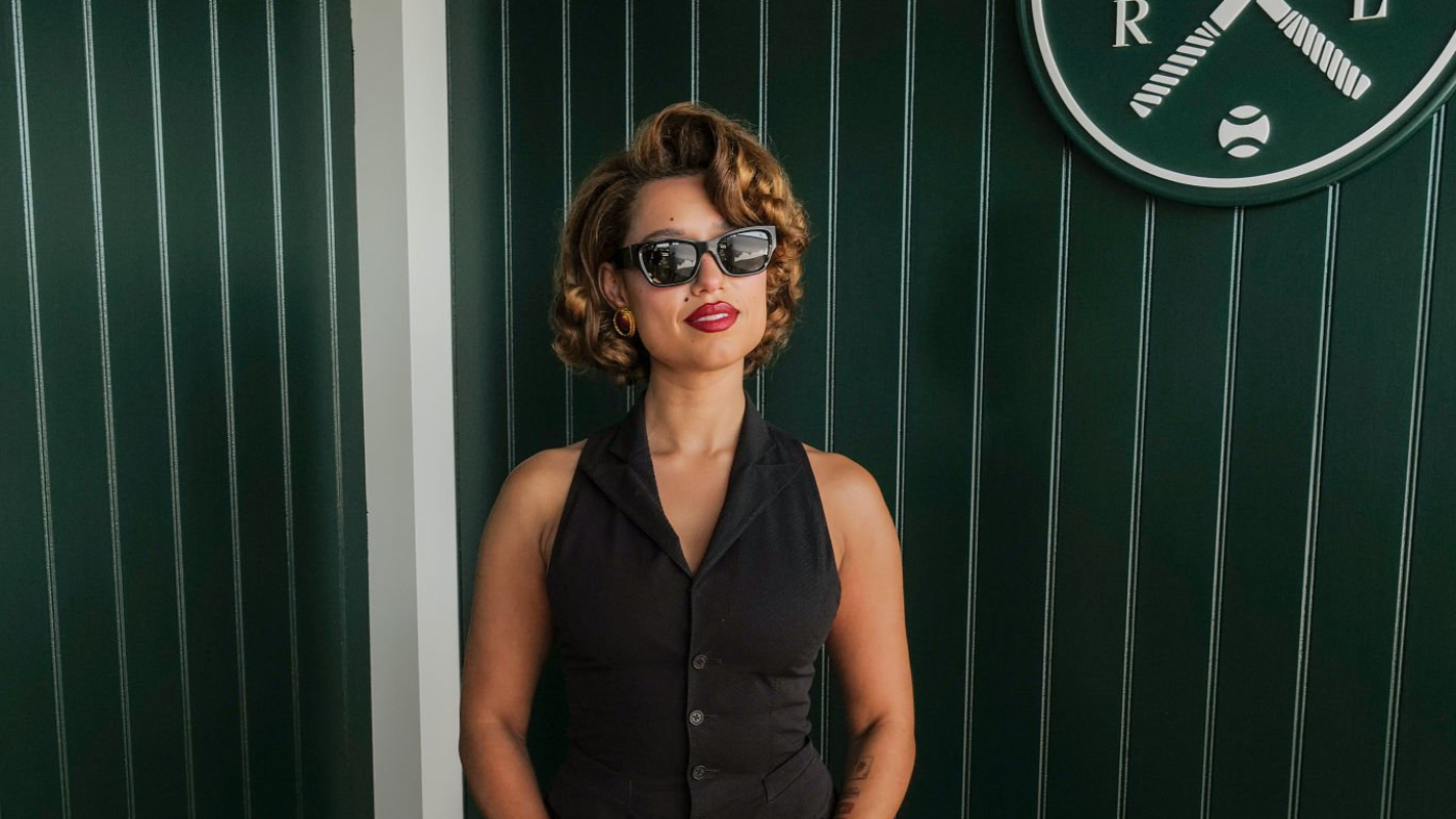 RAYE - LONDON, ENGLAND - JULY 12: Raye, wearing Ralph Lauren, attends The Championships, Wimbledon at All England Lawn Tennis and Croquet Club on July 12, 2026 in London, England. (Photo by Darren Gerrish/WireImage for Ralph Lauren)