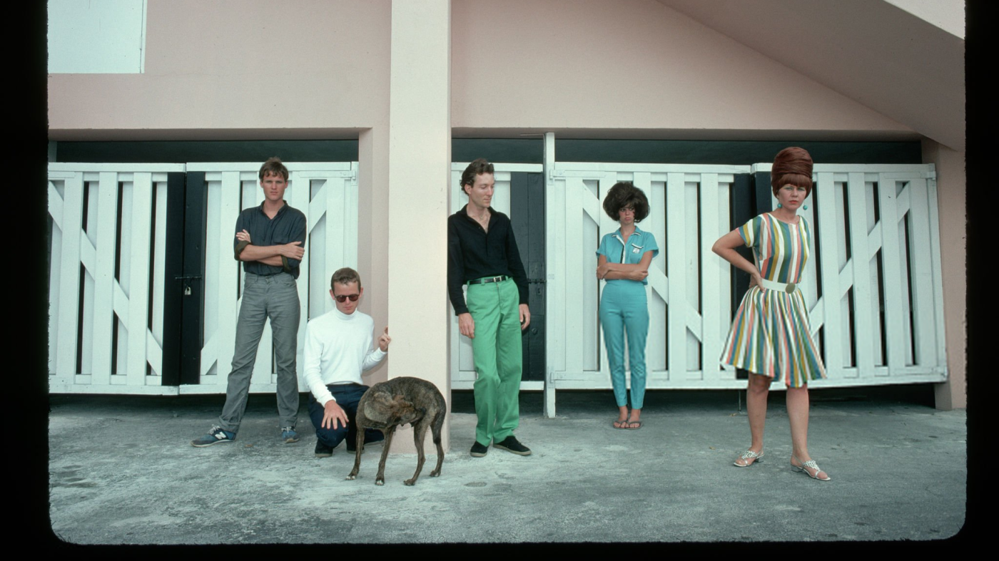 The B-52s - CIRCA DATE: The members of the rock/new wave group the B-52s pose in front of a building. From left to right: Keith Strickland, drums; Ricky Wilson, guitar; Fred Schneider, vocals; Cindy Wilson, guitar and vocals; Kate Pierson, keyboards and vocals. (Photo by Lynn Goldsmith/Corbis/VCG via Getty Images)