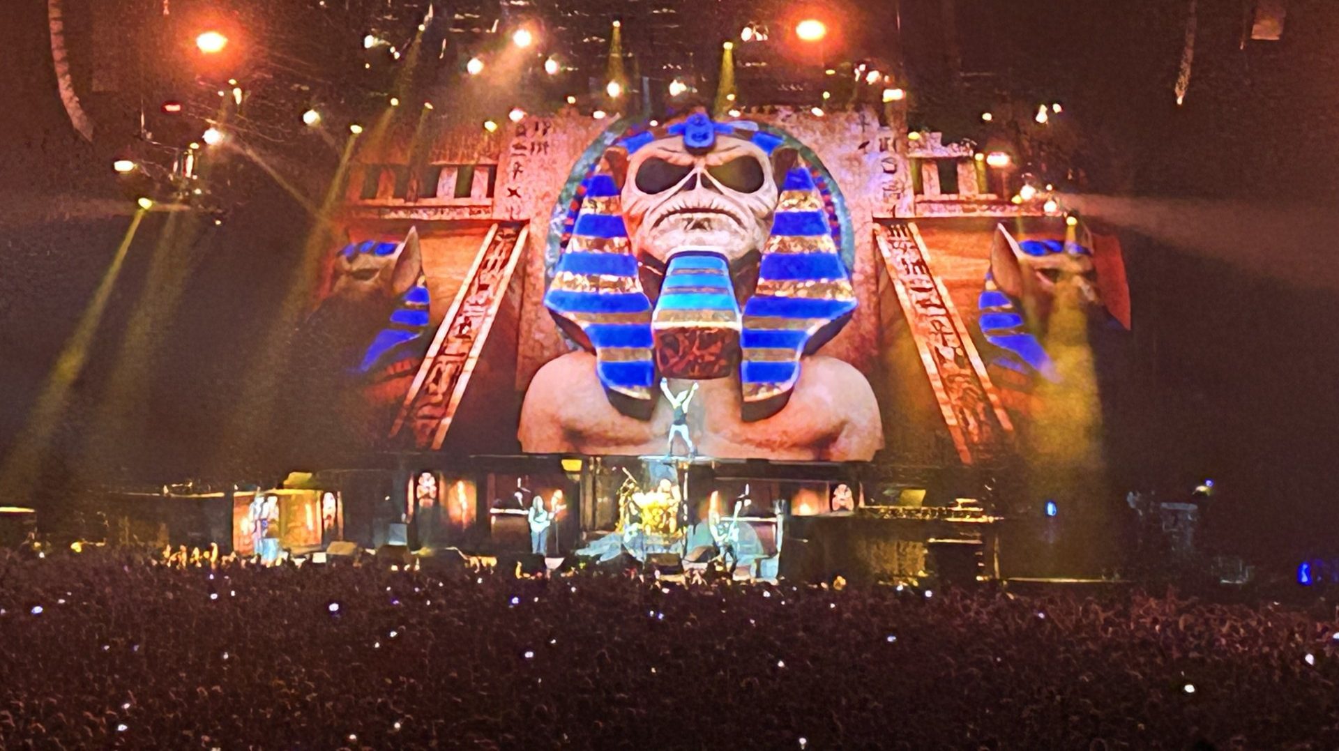 Iron Maiden performing beneath an Egyptian-themed stage backdrop